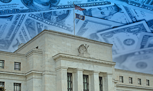 US Federal Reserve (Fed) building against the backdrop of banknotes