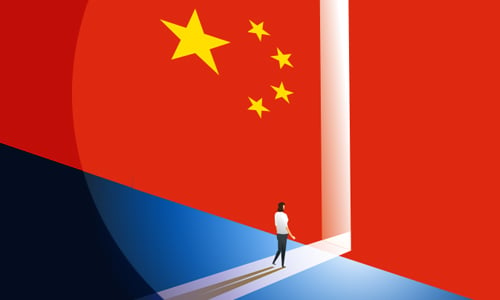 Man standing in a doorway with the China flag